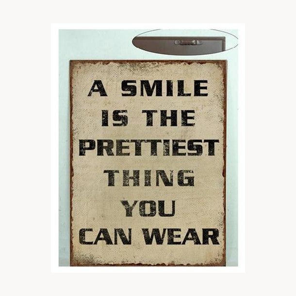 Sign - A smile is the prettiest thing you can wear